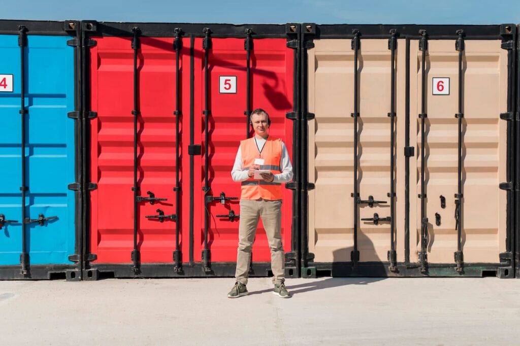 man standing near container lashing